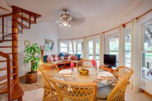 Dining and Living Space with Spiral Staircase in Xanadu Island Resort Belize