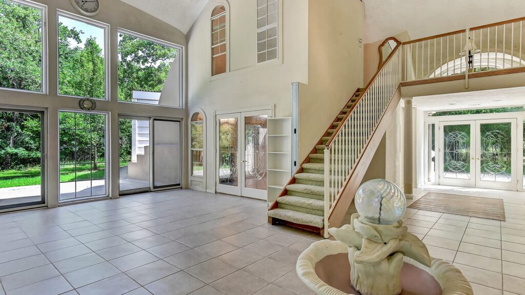 This Pottsboro, TX dome home demonstrates how conventional doors and windows can still be a part of a dome home's architecture—quite literally from top to bottom.